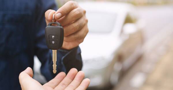 rsz car key businessman handing over gives the car key royalty free image 1589031658